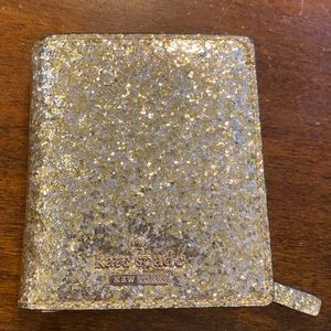 Kate Spade “Stacy” glitter wallet in gold